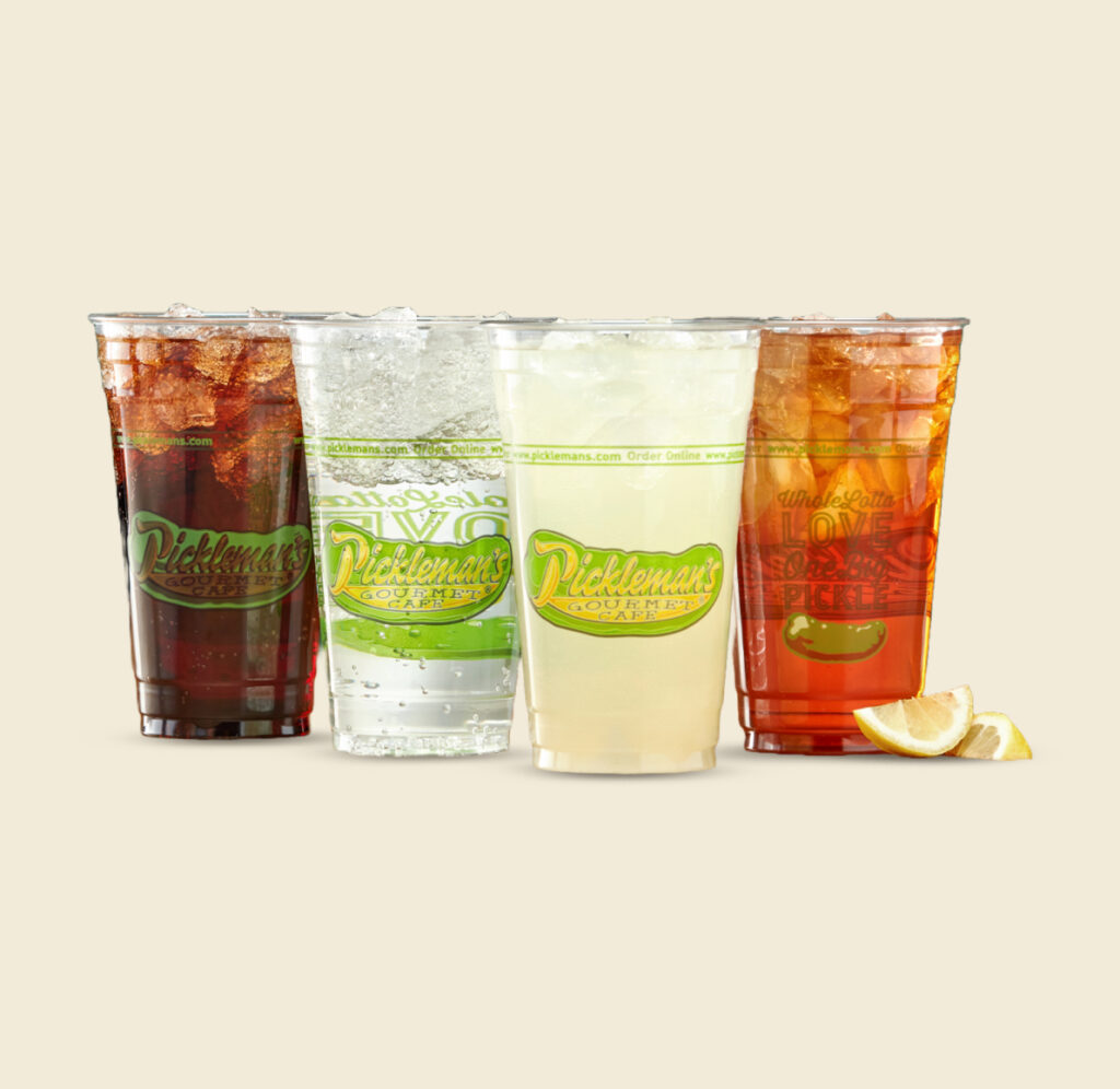 Four Pickleman’s beverage cups filled with soda, sparkling water, lemonade, and iced tea, served over ice.